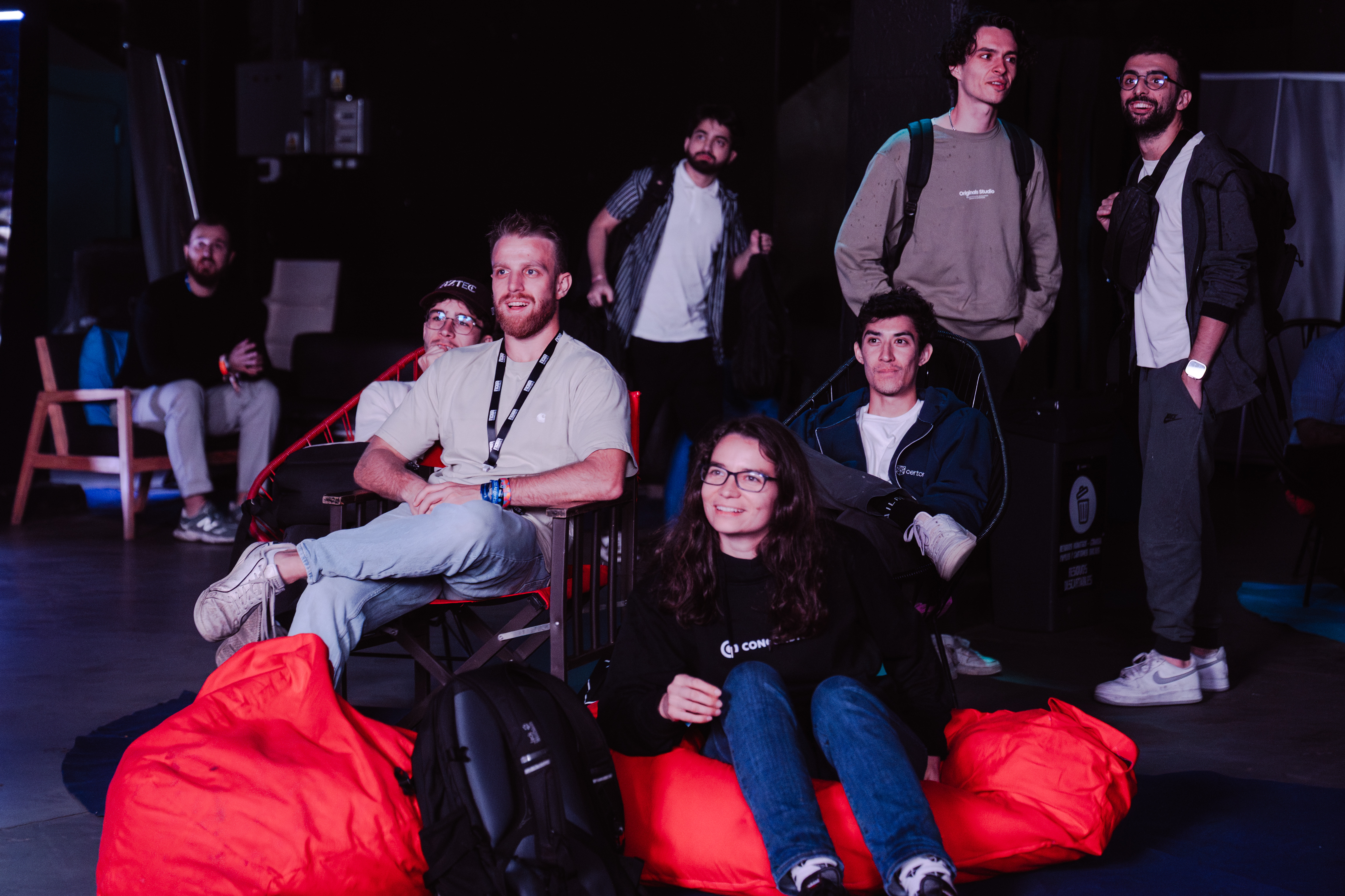 Audience seated on beanbags watching the competition